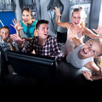 Family at Escape Rooms during the Summer Holidays Family at Escape Rooms during the Summer Holidays