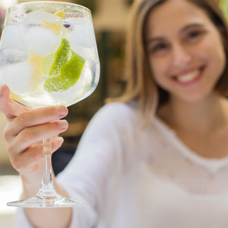 Woman with a gin and tonic Woman with a gin and tonic
